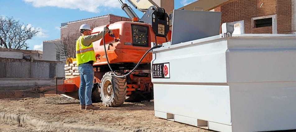 Construction worker refueling an orange boom lift from a white FuelCube storage tank on an outdoor jobsite. Construction worker refueling an orange boom lift from a white FuelCube storage tank on an outdoor jobsite.
