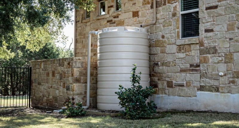 Large corrugated steel water storage tank installed on a farm for rainwater harvesting Large corrugated steel water storage tank installed on a farm for rainwater harvesting