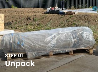 Wrapped inflatable concrete tank package on a wooden pallet labeled Step 01: Unpack at an outdoor installation site. Wrapped inflatable concrete tank package on a wooden pallet labeled Step 01: Unpack at an outdoor installation site.